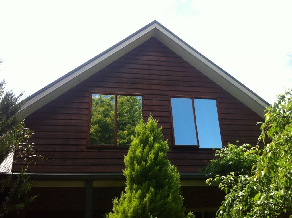 AlpineTint highly reflective mirrored solar control window film installation done in Bright.